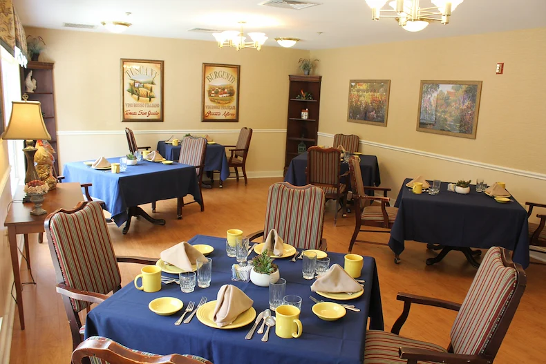 Well-lit dining room at Charter Senior Living of Jackson in Jackson, TN, with neatly set tables, designed for comfort and social dining in assisted living and memory care.