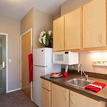 Avamere at St. Helens senior living community offering independent living, assisted living, memory care, and respite care in St. Helens, OR, apartment kitchenette