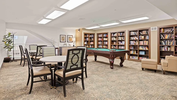 Bear Hollow Estates Hawthorn Senior Independent Living in Rancho Cordova, California, game room and libray featuring a pool table and large bookshelves