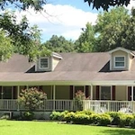 Dream Catcher Senior Living, assisted living community in Jackson, GA, exterior with lush landscaping and inviting porch