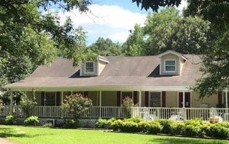 Dream Catcher Senior Living, assisted living community in Jackson, GA, exterior with lush landscaping and inviting porch