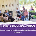 Residents and team members enjoying time outdoors on our covered porch.
