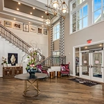 The Commons on Meridian Senior Living in Indianapolis, IN interior entrance with staircase