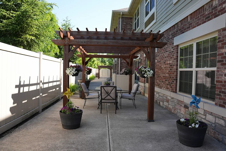 Allisonville Meadows Assisted Living offering assisted living, memory care, and respite care in Fishers, IN, outdoor patio seating area featuring a gazebo