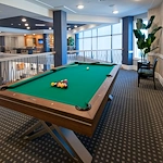 Allegro Parkland, senior living community offering independent living, assisted living, memory care, and respite care in Parkland, FL, activities area featuring a pool table 