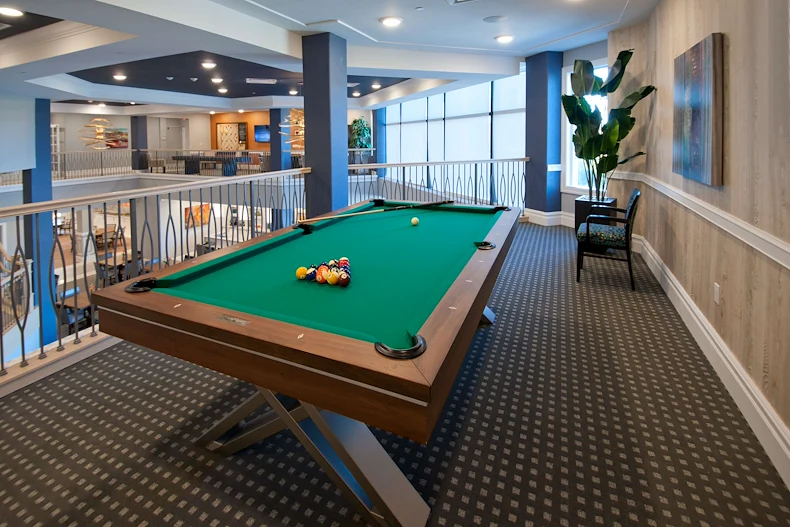 Allegro Parkland, senior living community offering independent living, assisted living, memory care, and respite care in Parkland, FL, activities area featuring a pool table 