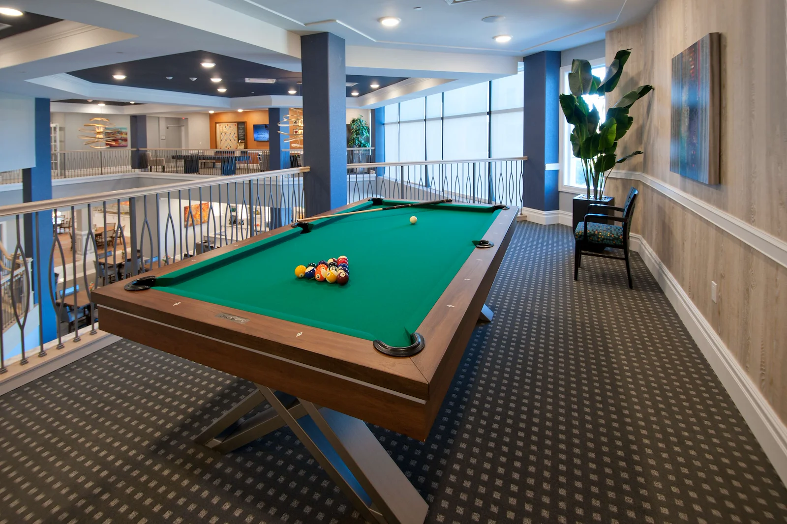 Allegro Parkland, senior living community offering independent living, assisted living, memory care, and respite care in Parkland, FL, activities area featuring a pool table 