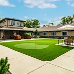 Harvester Place Senior Assisted Living Memory Care in Burr Ridge, IL rear exterior mini golf putt putt area