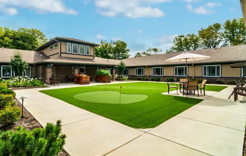 Harvester Place Senior Assisted Living Memory Care in Burr Ridge, IL rear exterior mini golf putt putt area