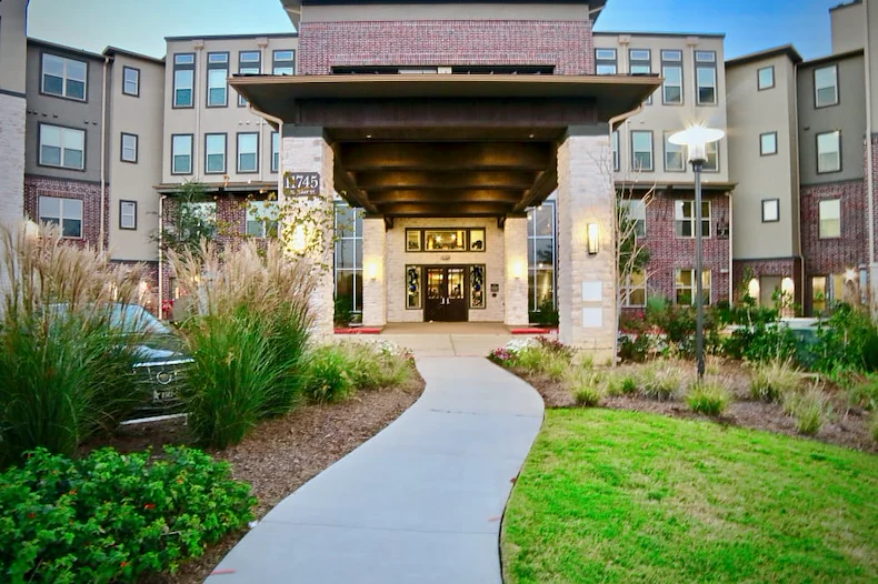 Active adult living and independent living at Watercrest at Shadow Creek Ranch in Pearland, TX, front exterior entrance