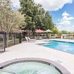 Independent living, assisted living, memory care, and continuing care retirement community (CCRC) at Brook Ridge-The Gardens Retirement Community in Pharr, TX, outdoor pool and hot tub