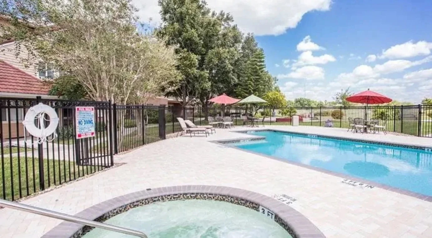 Independent living, assisted living, memory care, and continuing care retirement community (CCRC) at Brook Ridge-The Gardens Retirement Community in Pharr, TX, outdoor pool and hot tub