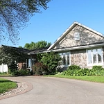 Legato Living Residential Memory Care at Legacy senior living community offering assisted living, memory care, adult day services, and respite care in Omaha, NE, front exterior and circular driveway