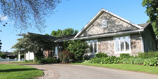 Legato Living Residential Memory Care at Legacy senior living community offering assisted living, memory care, adult day services, and respite care in Omaha, NE, front exterior and circular driveway