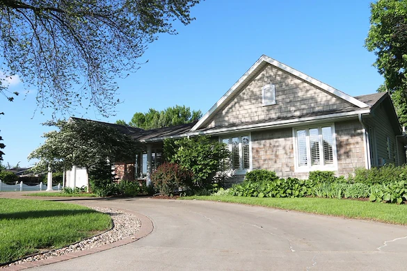 Legato Living Residential Memory Care at Legacy senior living community offering assisted living, memory care, adult day services, and respite care in Omaha, NE, front exterior and circular driveway