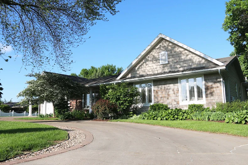 Legato Living Residential Memory Care at Legacy senior living community offering assisted living, memory care, adult day services, and respite care in Omaha, NE, front exterior and circular driveway