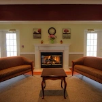 Pathfinder Senior Living in Fremont, NE, visiting area by fireplace