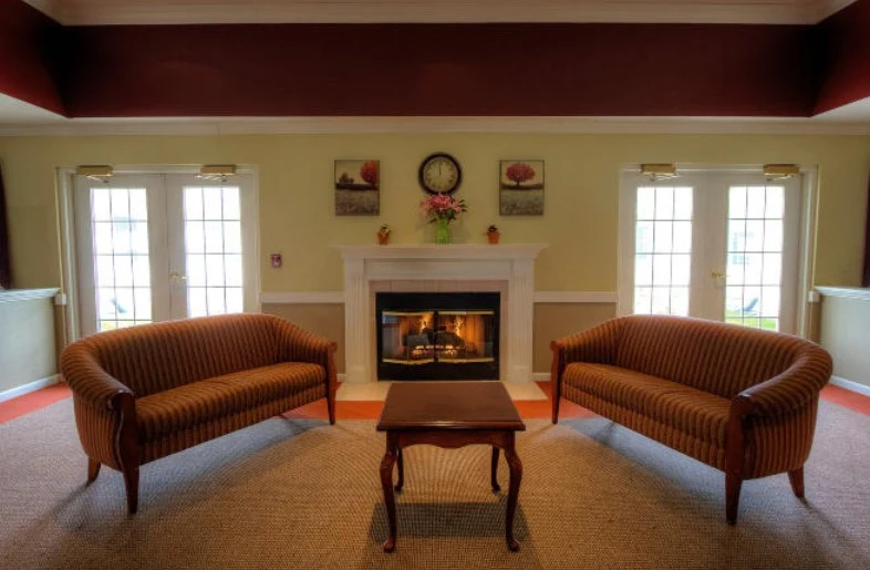 Pathfinder Senior Living in Fremont, NE, visiting area by fireplace