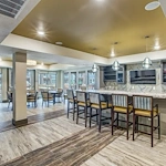Watermere McKinney senior living community offering active adult living and independent living in McKinney, TX, dining room and community kitchen with bar top seating