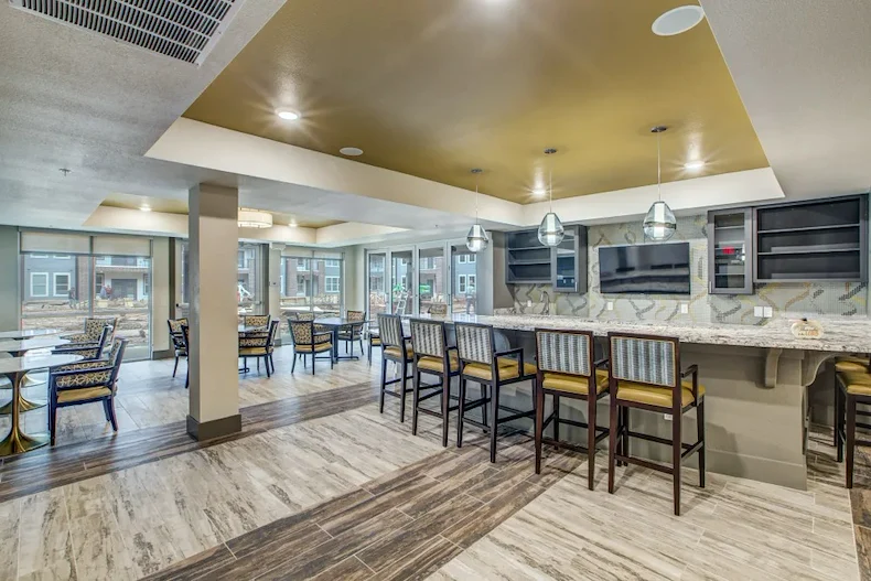 Watermere McKinney senior living community offering active adult living and independent living in McKinney, TX, dining room and community kitchen with bar top seating
