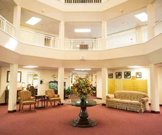 Independent living, assisted living, memory care, and continuing care retirement community (CCRC) at Brook Ridge-The Gardens Retirement Community in Pharr, TX, lobby sitting area