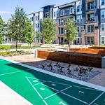 Watermere at Woodland Lakes senior living community offering active adult living and independent living in Conroe, TX, outdoor space with a walking path, activities, and garden beds