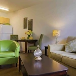 The Lodge at Wake Forest Gracious Retirement Living Hawthorn Senior Independent Living in Wake Forest, North Carolina apartment living room and kitchenette