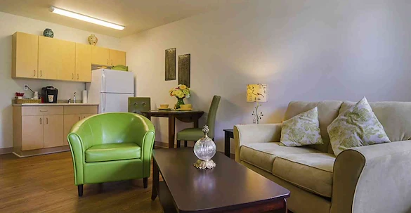 The Lodge at Wake Forest Gracious Retirement Living Hawthorn Senior Independent Living in Wake Forest, North Carolina apartment living room and kitchenette