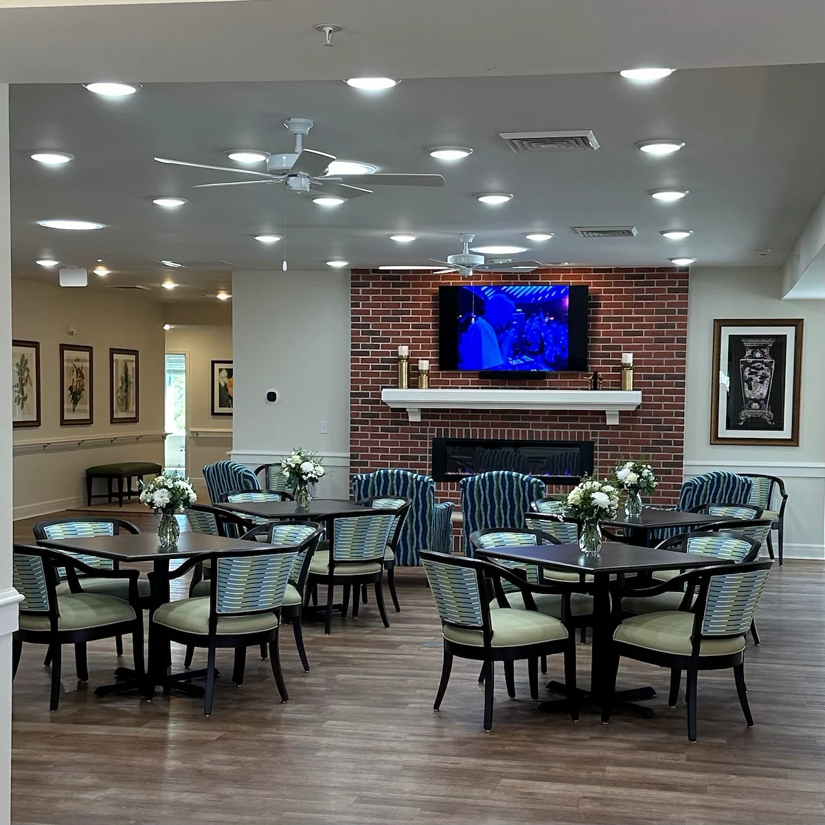 Faith Cottages Memory Care Basehor, KS, sitting area with tables by fireplace