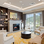Alto Overland Park, senior living community offering assisted living and memory care in Overland Park, KS, community sitting area by a fireplace
