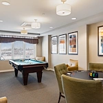 Alto Grayslake, senior living community offering assisted living, memory care, and respite care in Grayslake, IL, activities room featuring a pool table and a table for games