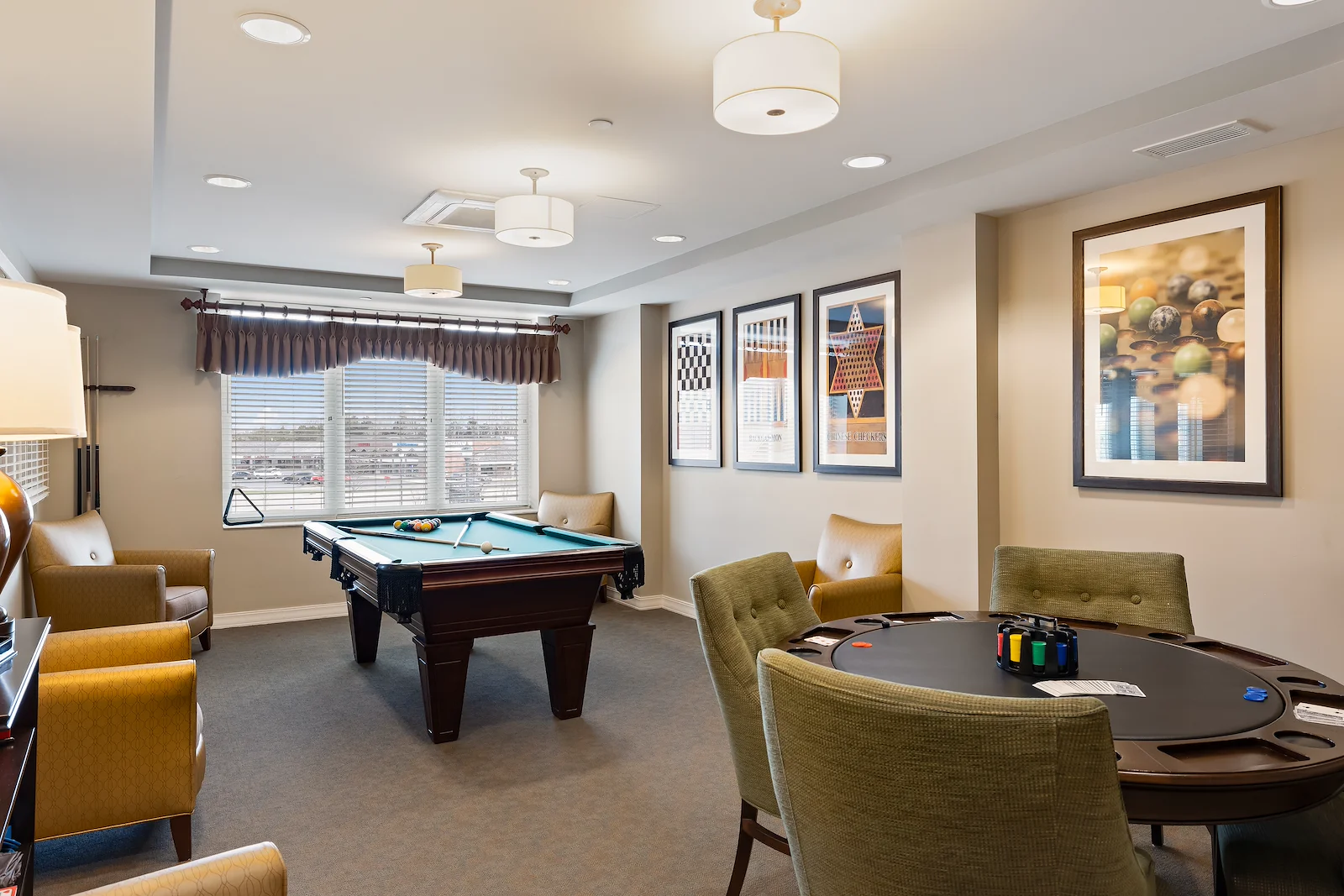 Alto Grayslake, senior living community offering assisted living, memory care, and respite care in Grayslake, IL, activities room featuring a pool table and a table for games