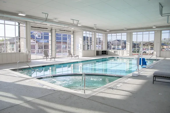 Watermere at Flower Mound senior living community offering active adult living and independent living in Flower Mound, TX, indoor pool with large garage doors that open to the outdoors