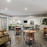 Alto Wheaton, senior living community offering assisted living, memory care, and respite care in Wheaton, IL, community gathering area with seating for socializing and activities