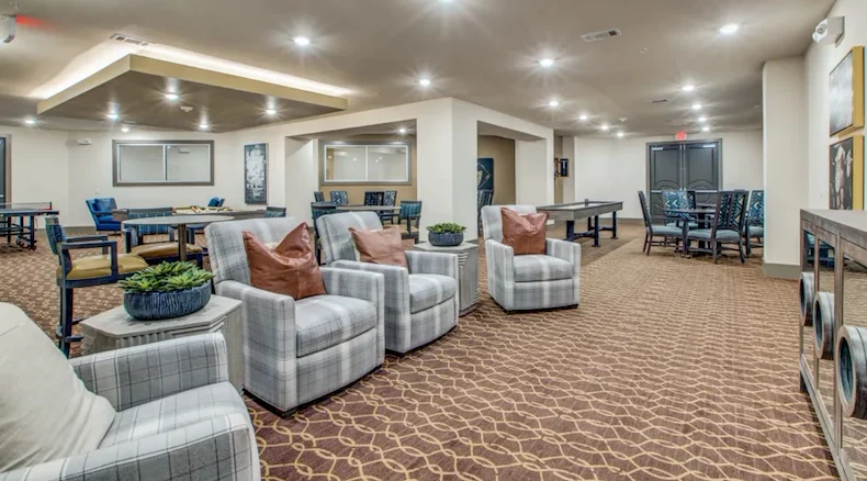 Watermere at Woodland Lakes senior living community offering active adult living and independent living in Conroe, TX, lounging area in the activities/game room