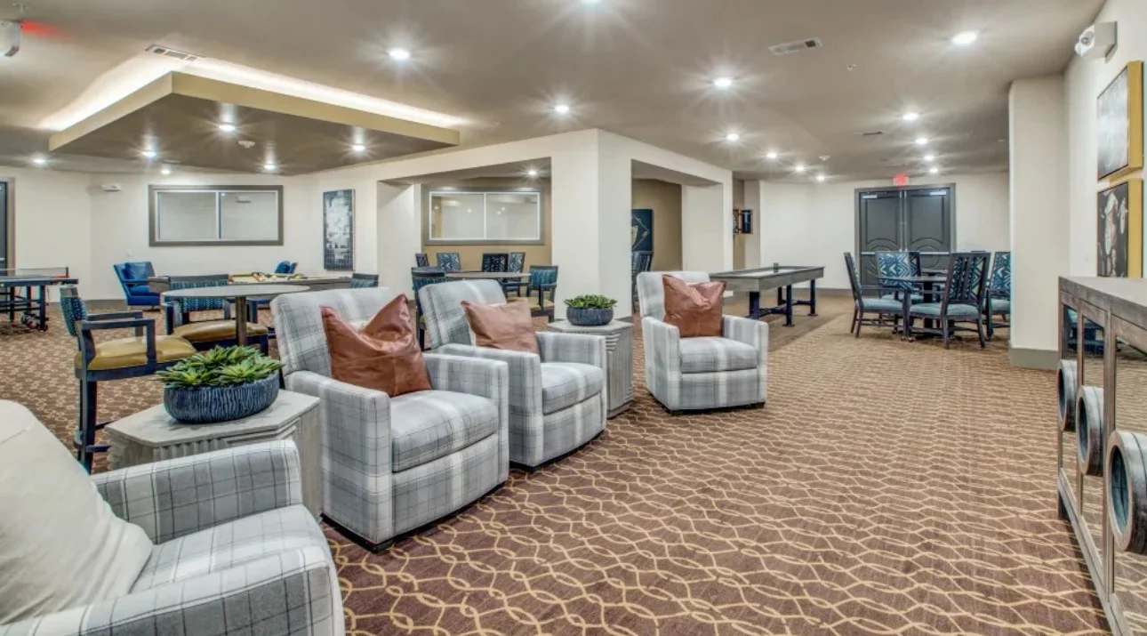 Watermere at Woodland Lakes senior living community offering active adult living and independent living in Conroe, TX, lounging area in the activities/game room