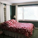 Legato Living Residential Memory Care at Legacy senior living community offering assisted living, memory care, adult day services, and respite care in Omaha, NE, bedroom with great natural lighting