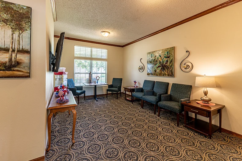 Ashbrook Village senior living community offering independent living, assisted living, and memory care in Duncan, OK, community movie room and sitting area