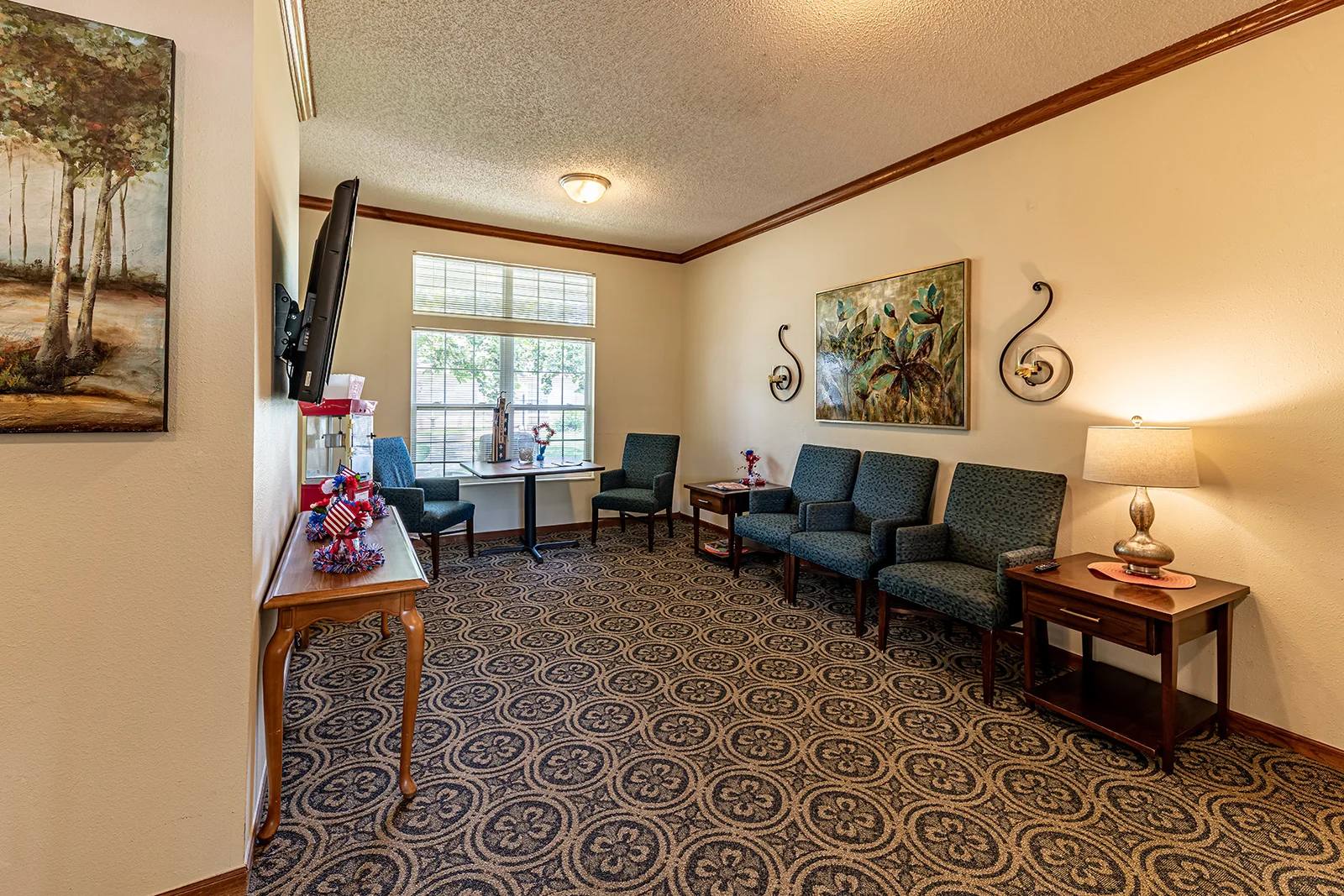 Ashbrook Village senior living community offering independent living, assisted living, and memory care in Duncan, OK, community movie room and sitting area