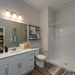 Acclaim at The Hill, senior living community offering active adult and independent living in Fredericksburg, VA, apartment bathroom with walk-in shower 