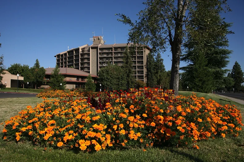 Rosewood Senior Living in Bakersfield, CA, outdoor space with beautiful flowers