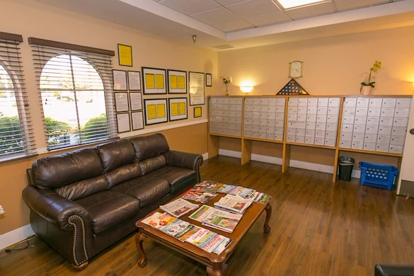 Lexington Assisted Living senior living community offering independent living, assisted living, and memory care in Ventura, CA, mail room with personal mailboxes and a couch
