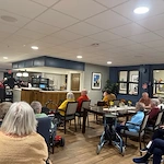 Residents of the Waters of Oak Creek enjoy music therapy brought to them by the South Milwaukee Municipal Band