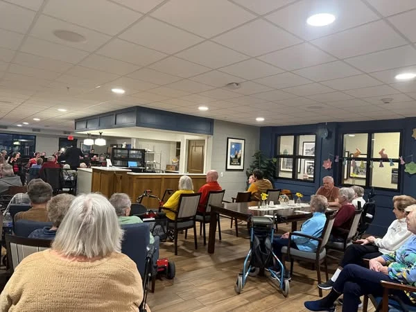 Residents of the Waters of Oak Creek enjoy music therapy brought to them by the South Milwaukee Municipal Band