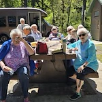 Gilman Grove Assisted Senior Living in Oregon City, Oregon residents eating lunch outside