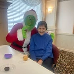 Ascension Living Via Christi Village McLean Senior Living in Wichita, Kansas resident with the Grinch at a Christmas party