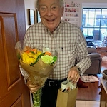 Covenant Living at the Samarkand in Santa Barbara, CA, happy resident after receiving a kind gift