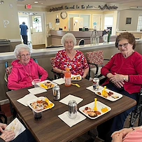 Pathfinder Senior Living in Fremont, NE, residents enjoy dining together and socializing
