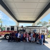 The Savoy Gracious Retirement Living Hawthorn Senior Independent Living in Winter Springs, Florida residents touring a firetruck