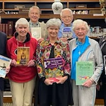 Ascension Living Alexian Village Tennessee Senior Living, independent living, assisted living, memory care, and continuing care retirement community (CCRC) in Signal Mountain, TN, residents smiling while holding books